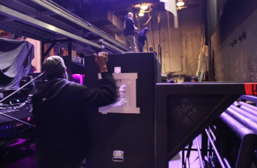 Stagehand members of IATSE Local 74 load in wardrobe for a traveling performance of “HITS! The Musical” backstage at the Shubert Theatre in New Haven on March 7, 2023.