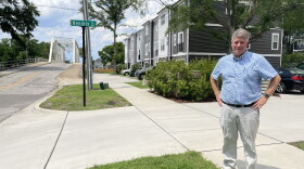 Developer Dave Spetrino stands on 6th, in front of his townhome development. Because the new construction is situated next to the bridge over the former railroad, they don't seem much higher than the surrounding single-family homes.