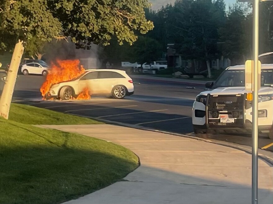 The fire appeared to emanate from the hatchback's engine compartment.