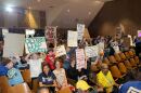 Students protest teacher layoffs inside the Cleveland Board of Education meeting at East Professional Center Tuesday in Cleveland.