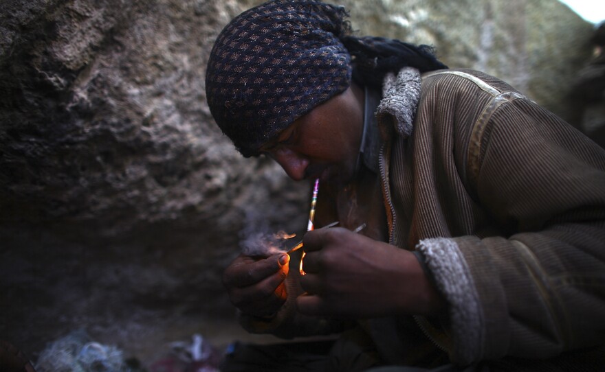 Ahmad, who wouldn't give his last name, smokes heroin. He lives in a makeshift village filled with drug addicts called Kamar Kulagh, on the outskirts of the western Afghan city of Herat.