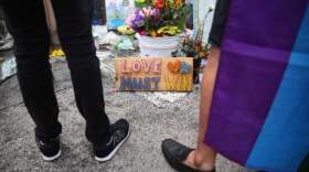 One year after the Pulse shooting, the community gathers at the club for vigils and remembrance. Photo: Joey Roulette