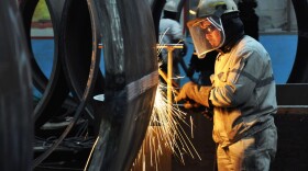 A worker cuts steel in Qingdao in China's eastern Shandong province. President Trump said Thursday that he plans to impose tariffs on U.S. imports of steel and aluminum.