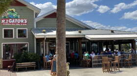 Customers pack the patio bar and tables at RJ Gators in Lake Sumter Landing in The Villages Friday afternoon. Photo: Joe Byrnes