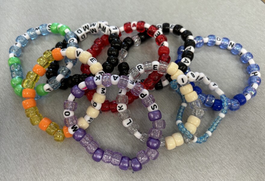 A close up image of Taylor Swift inspired friendship bracelets.