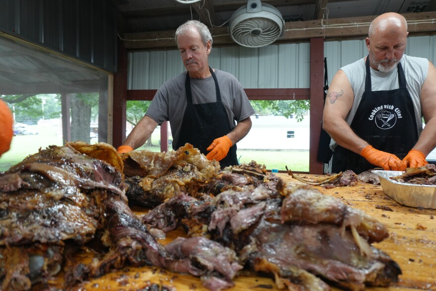 Volunteers slice and dice barbecue behind the scenes at the 146th annual Fancy Farm picnic.