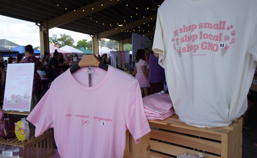 A Girls Night Out T‑shirt hangs at the GNO Events table during the monthly market at the Ocala Downtown Market in Ocala, Fla., on June 6, 2026.