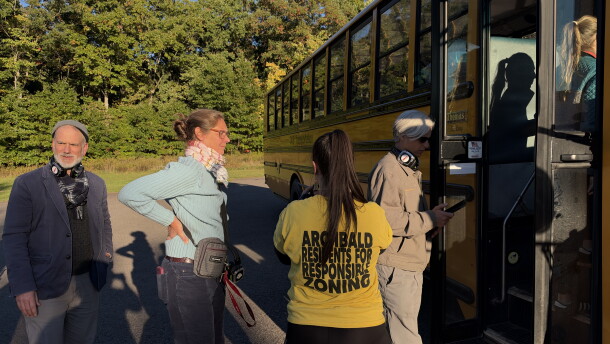 Christian and Melinda Krokus and Jill Baer head onto a bus tour of proposed data center campuses in Archbald. Tamara Misewicz-Healey, cofounder of the Stop Archbald Data Centers group, stands in the yellow shirt.