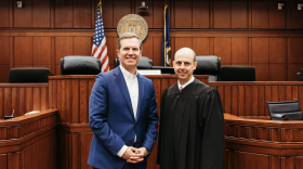A photo on the campaign website of Judge Will Moynahan features him standing in a courtroom next to Gov. Andy Beshear (left), who is supporting him in his Kentucky Court of Appeals race.