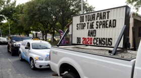 A sign on the back of a truck promotes 2020 census participation in Reading, Pa. A day after the Census Bureau announced a new "target date" for ending counting efforts, a federal judge in California said she thinks the schedule is "a violation" of her court order.