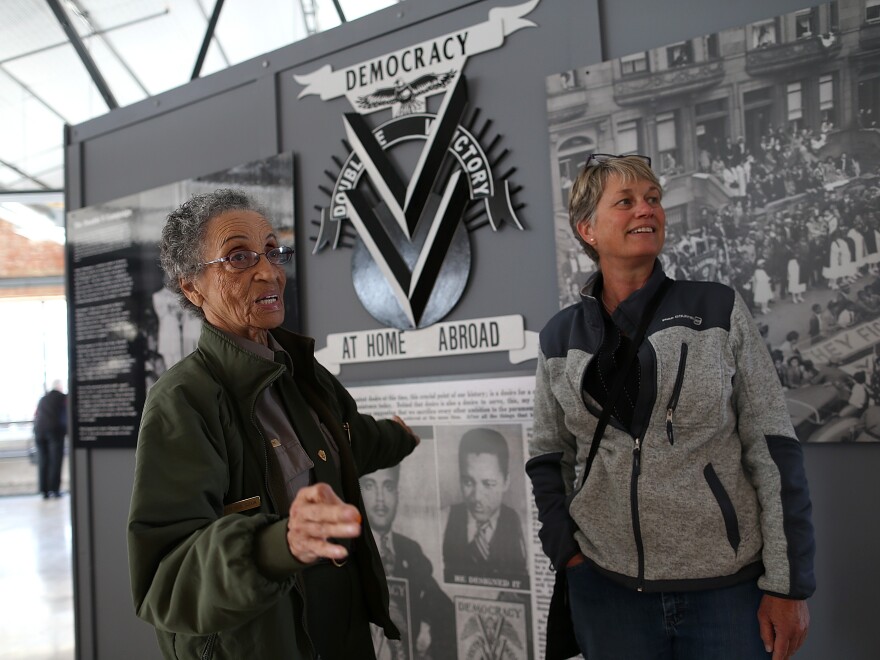 National Park Service ranger Betty Reid Soskin, left, talks with a visitor at the Rosie the Riveter World War II Home Front National Historical Park on Oct. 24, 2013. in Richmond, Calif. Soskin leads tours, speaks to groups and answers questions about living and working in the area during WWII.