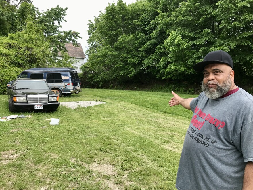 Ron Brown of Cleveland gestures toward a large vacant parcel on Cleveland's East Side.