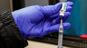 A syringe is filled with the Johnson & Johnson COVID-19 vaccine.