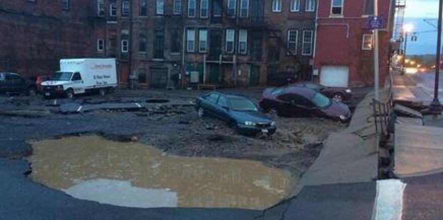 Flooding and damage in parking lot on Basin St. in Penn Yan