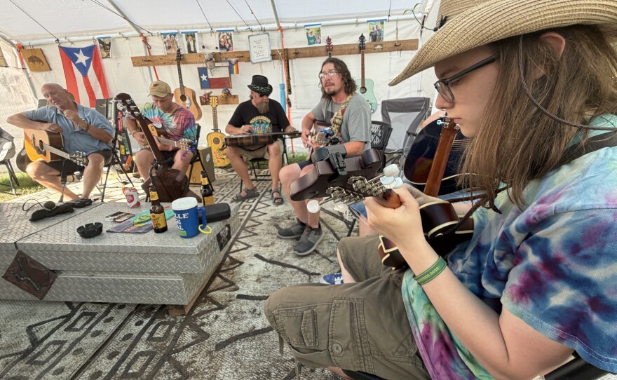 A guitar circle at "Dances With Armadillos" that includes a Mandolin.