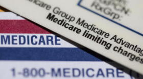 A Medicare Advantage PPO card rests on top of a Medicare card in Portland, Ore., June 10, 2024. (Jenny Kane/AP)