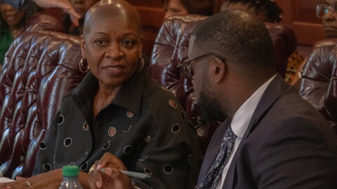 Darlene Dunmeyer-Roberson (left) and her attorney, state Rep. Kambrell Garvin (right) speak at a September hearing in a conference room on the Statehouse grounds. Dunmeyer-Roberson will ultimately stay on the Charleston County School District board. Her term expires in 2028.