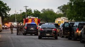 Police block off the road leading to Robb Elementary on May 24, the day a gunman killed 19 students and two teachers in Uvalde.