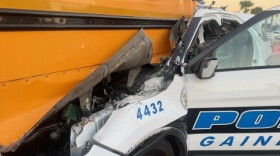 An off-duty Gainesville Police officer hit a school bus in Marion County Friday morning. Four were hurt in the accident.
