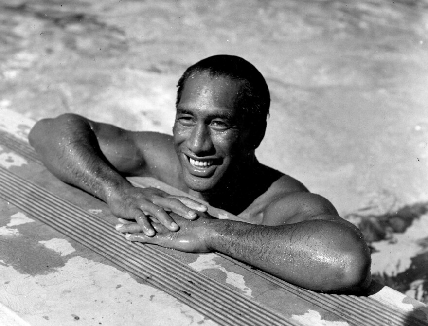 FILE - In this Aug. 11, 1933, file photo, Duke Kahanamoku poses in a swimming pool in Los Angeles. (AP Photo/File)