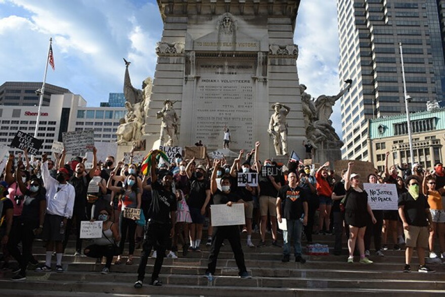 Protesters gathered at Monument Circle Tuesday evening after marching to the City-County Building and the Indiana Statehouse.