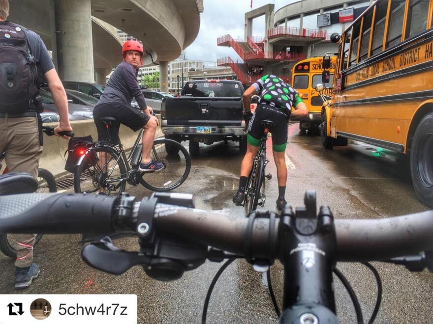 Cyclists had to deal with rain and traffic along the Flying Pig route.