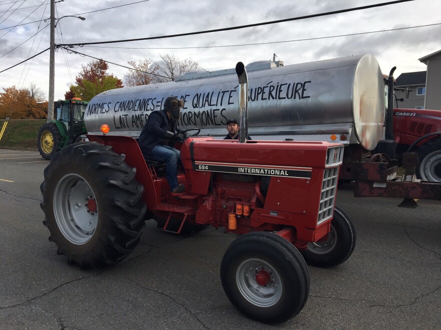 Farmers led a tractor parade down the streets of Granby, Quebec to protest the new trade deal.