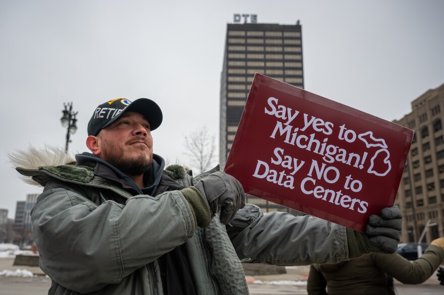 Protesters gathered near DTE Energy's Detroit headquarters to oppose the utility's plan for providing power to a proposed data center in rural Washtenaw County.