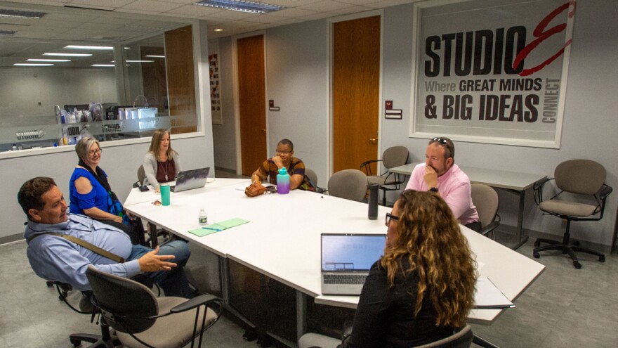 business people gathering around a table