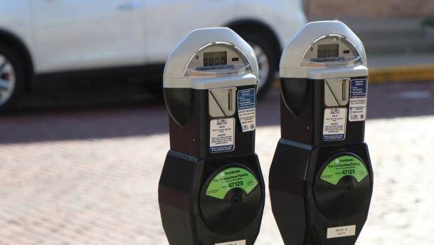 a close up of two City of Columbia parking meters. 