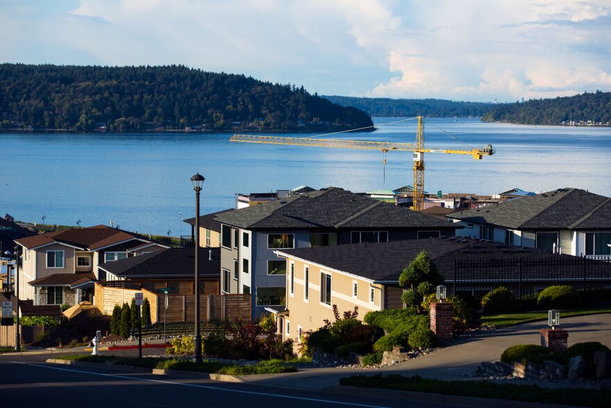 Houses overlook Commencement Bay in Tacoma. Real estate agents disagree on whether it's safe to buy and sell homes during a pandemic. 