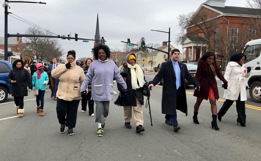 Marchers head down Main Street in Middletown during an annual celebration Monday honoring Dr. Martin Luther King Jr.