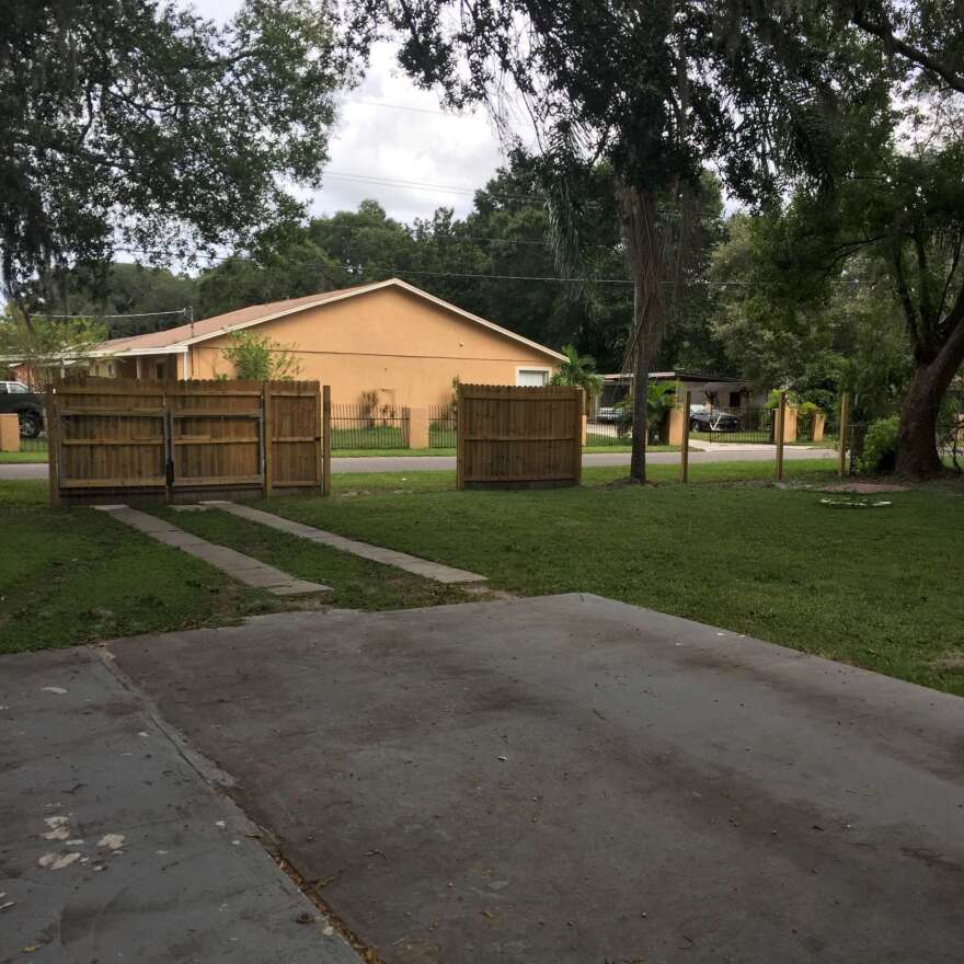 The fence of reporter Tyler Kline's neighbor, stripped of its wood because there was no plywood left to board up the house.