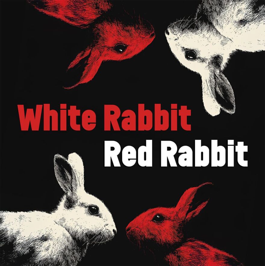 A white rabbit and a red rabbit at the bottom and top of the image with "White Rabbit Red Rabbit" written in the middle against a black background