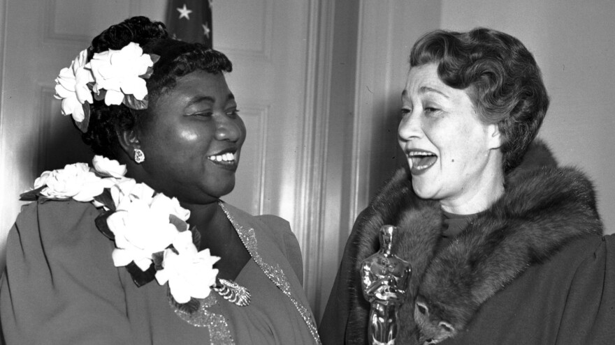 Actress Hattie McDaniel, left, appears with actress Fay Bainter, right, the night McDaniel won best supporting actress for her role in the 1939 film <em>Gone With the Wind</em> in Los Angeles on Feb. 29, 1940. The Academy of Motion Pictures Arts and Sciences has created a replacement of McDaniel's Academy Award plaque that it is gifting to Howard University.