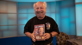 John Rinaldi with his book