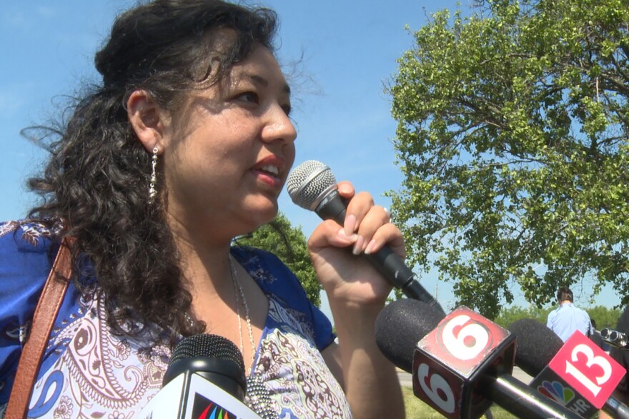 Erika Fierro speaks to media after returning from her immigration check-in. She was concerned Thursday's check-in would end in her immediate deportation.