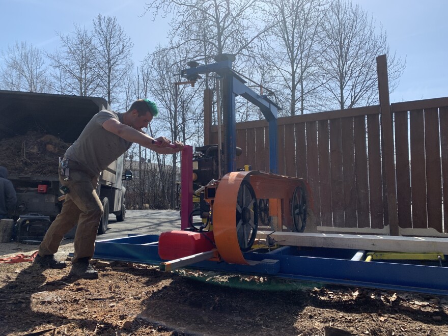 Hans Dow spends a Saturday afternoon milling more than 50 2x10s for garden boxes he’ll install in his South Anchorage backyard this summer. (Emily Schwing)