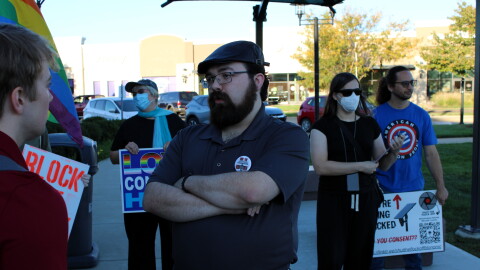 About 10 people gathered before Tuesday evening's council meeting in East Peoria's Levee Park to oppose the city's expansion of its Flock police camera program. Some were out-of-towners, whose opinions at least one councilmember said he would not consider. Ryan Gale, center, has been a vocal opponent of Flock in East Peoria. He grew up there, but now lives in nearby Creve Coeur.