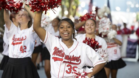 The Little League World Series parade included Williamsport Area High School cheerleaders and the marching band.
