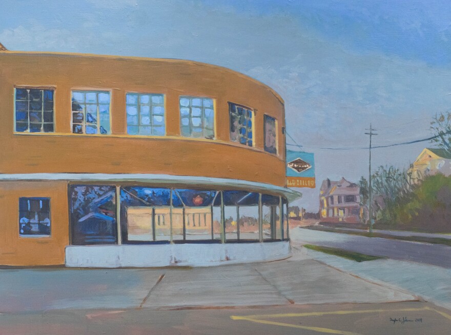 Artist Douglas Johnson's exhibit "A Sense of Place" includes paintings of familiar places such as the Clay Dooley building, seen here.