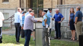 Members of the American Legion Post 13 stand by the podium after the joint press conference about Memorial Hall's renovations plans on July 21, 2026.