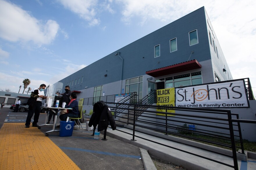 People come to the St. John's Well Child And Family Center to get inoculated with the Pfizer COVID-19 vaccine in South Los Angeles on Feb. 09, 2021. Photo by Shae Hammond for CalMatters