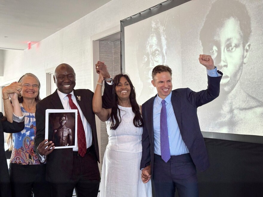 FILE - Susanna Moore, left, the great-great-great-granddaughter of Harvard biologist Louis Agassiz, celebrates with Tamara Lanier, second right, and attorneys Ben Crump and Josh Koskoff at the Boston Marriott Long Wharf hotel, May 28, 2025, in Boston, Mass. (AP Photo/Leah Willingham, File)