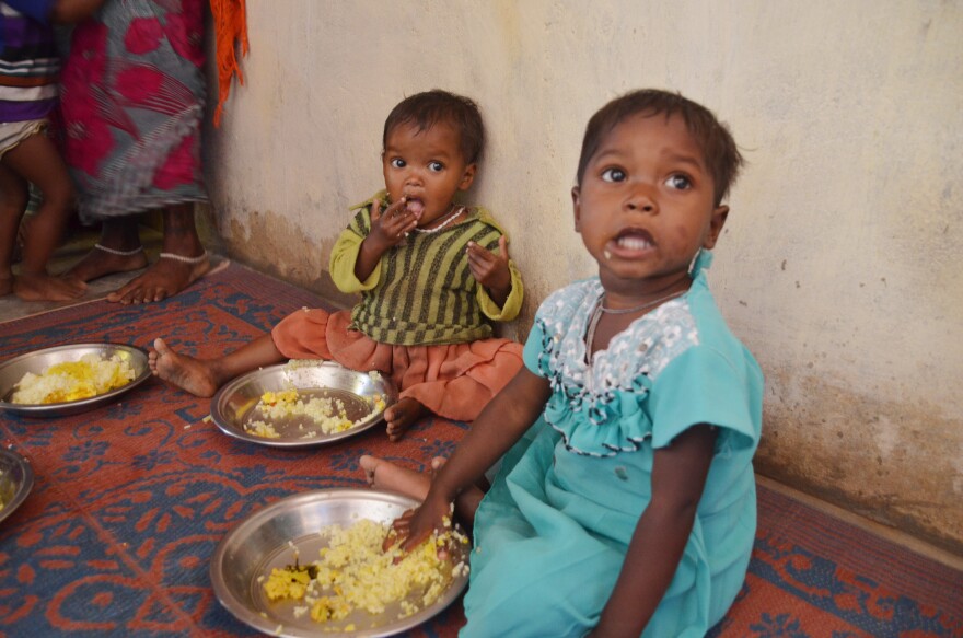 Toddlers enjoy a lunch of eggs and rice at a Fulwari in Haramar, a tribal village in northern Chhattisgarh.