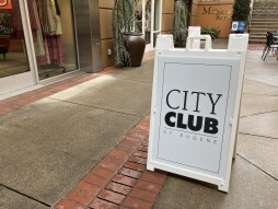Sandwich board advertising City Club of Eugene