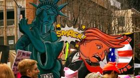 Signs from Saturday's march in Seattle, submitted by Sarah Reames on KUOW's Facebook page.
