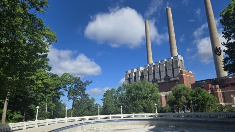empty Moores Park Pool basin and deck with the BWL Eckert Stacks in the background
