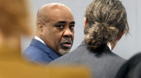Duane Davis, center, chats with his attorney Michael Sanft during the fourth day of jury selection for his murder trial in Clark County District Court at the Regional Justice Center on Thursday, Aug. 13, 2026, in Las Vegas. Davis was indicted on murder charges for his involvement in the killing of rapper Tupac Shakur in 1996. (Bizuayehu Tesfaye/Las Vegas Review-Journal via AP, Pool)