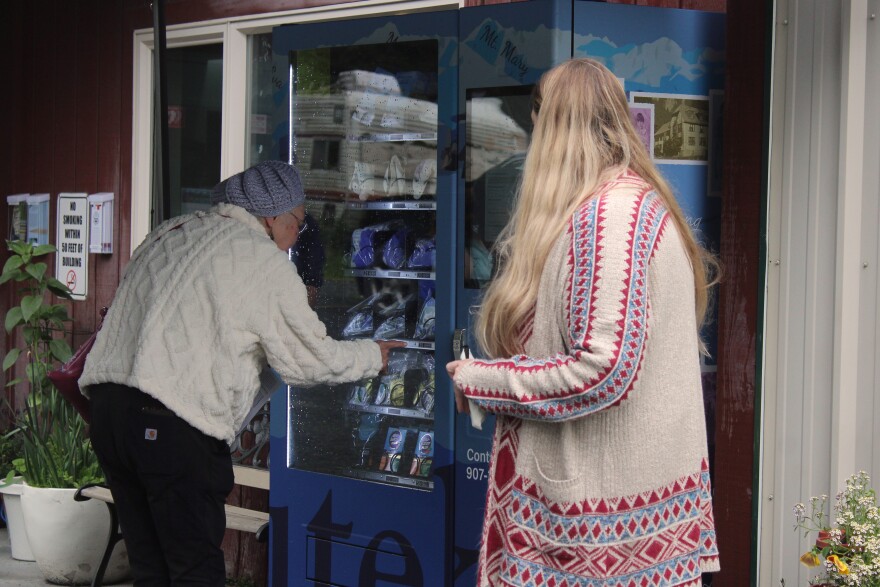 Kristin Wise helps someone use a new community health vending machine during an unveiling ceremony on Wednesday, July 22, 2026 in Seward, Alaska.